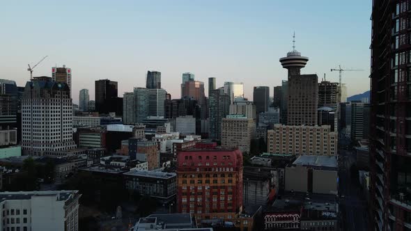 aerial drone footage of downtown Vancouver buildings, gastown, early sunrise, morning urban view. (B alt