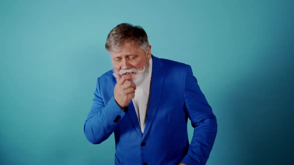 Funny senior man acting on a colored background alt