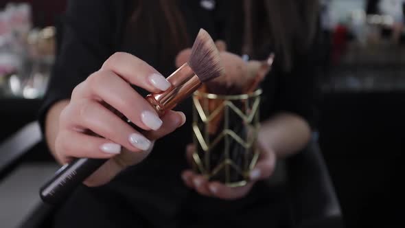 Profession Make Up Artist Woman Reviewing Beauty Products on a Video Blog at Beauty Studio alt