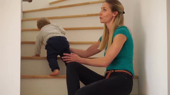 Baby Boy Crawling up Stairs alt