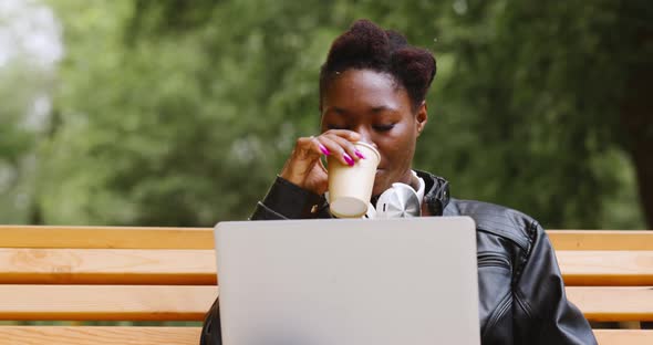 Woman with Laptop in the Park alt