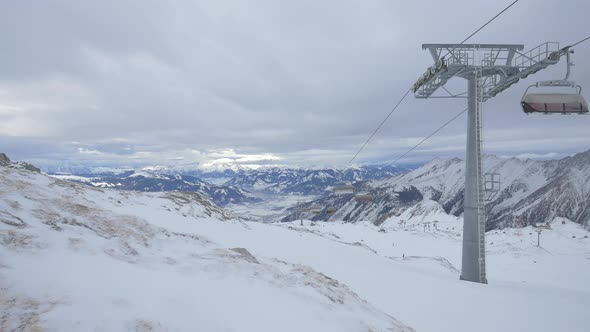 Chairlifts riding in the Alps alt