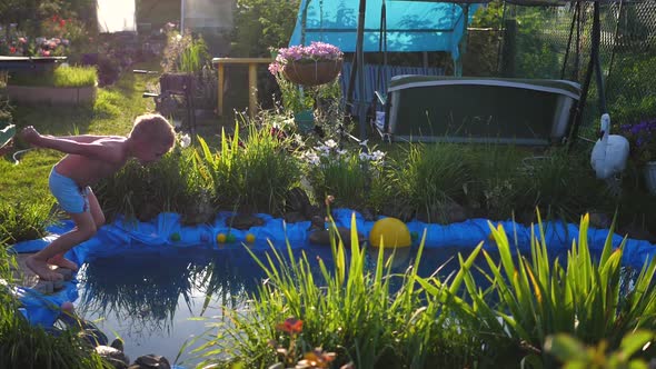 The Guy Is Swimming in a Small Lake on a Hot Summer Day alt
