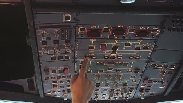 The cockpit of the aircraft. The pilot checks the electronics of the aircraft alt