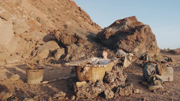 Woman Taking a Bath in Post Apocalyptic World alt