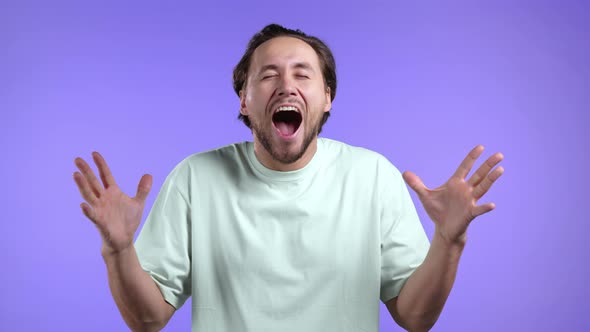 Young Man is Very Glad and Happy He is Screaming Loud Guy Achieved Result Goals alt