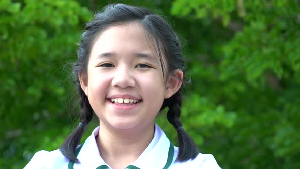 Close Up Of Asian Girl Smiling Outdoor alt