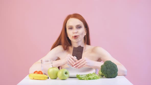 Happy Anorexic Girl Greedily Eats Chocolate. Violation of Diet. Poor Diet. Anorexia alt