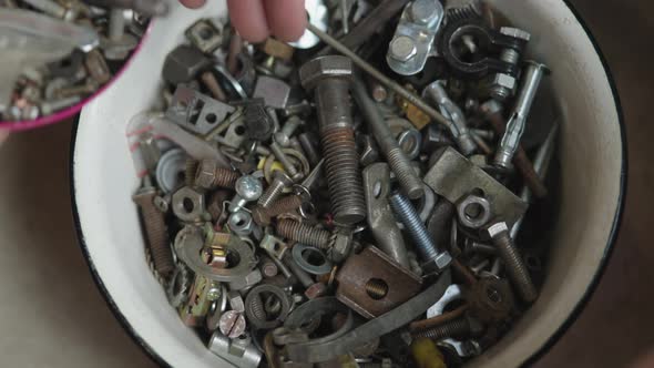 Lots of Different Screws Bolts Grommets and Fasteners Old and Used in Metal Bowl alt