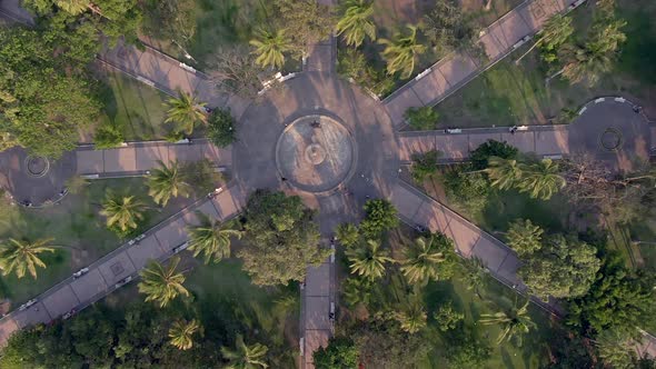 Top View Of Ornamental Fountain At The Center Of Garden With Tree Palms In Jardín Núñez, Colima Mexi alt