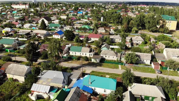 Flight Over Small Town On Sunset in Russia. Forward Movement