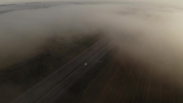 Drone Shot Of Highway Under Morning Mist