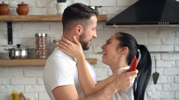 young couple at the kitchen. 