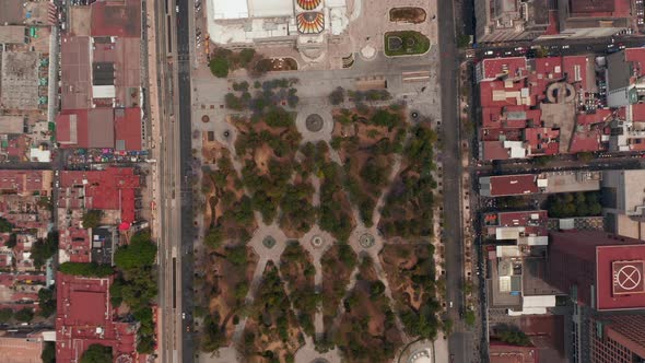 Aerial Birds Eye Overhead Top Down Panning View of Public Urban Park Alameda Central and Palacio De alt
