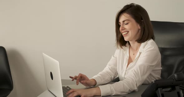 Portrait of a Cheerful Young Woman Working in the Office Female Accountant at Work
