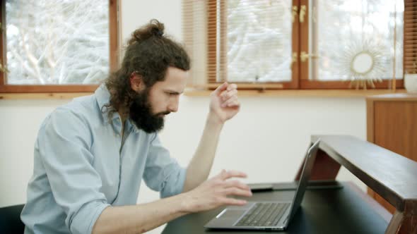 Spam Emails are Poured on the Head of a Man Who Works at Home and Comes to His Email alt