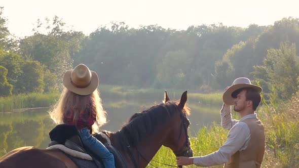 Cowboy and His Daughter on Horseback alt