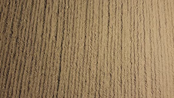 Plowed ground soil for agriculture cultivation aerial view alt