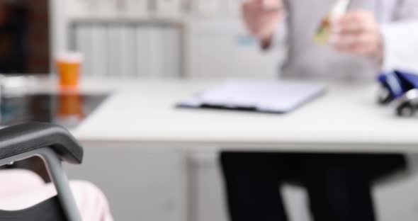 Doctor Prescribes Marijuana Oil for Patient in Wheelchair alt