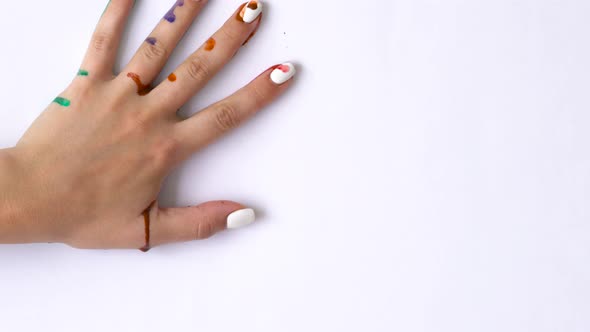 Creative Concept  Man and Woman Make Prints of Their Painted Hands on a White Background alt