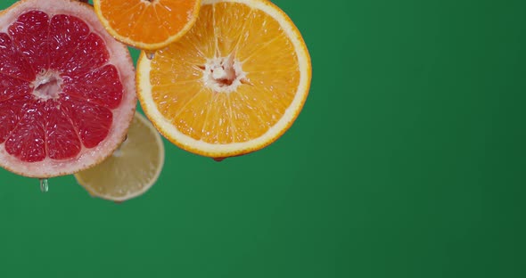 With Slices of Ripe Citrus Fall a Drop of Water. 