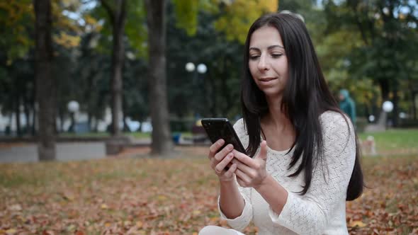 Woman Writing Message on Phone alt