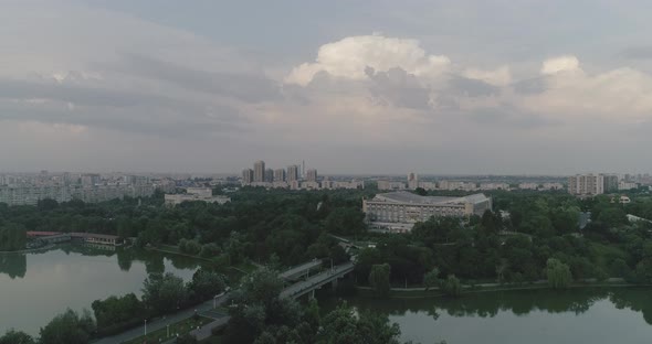Aerial shot above Bucharest. View above Tineretului park, evening shot vlog
