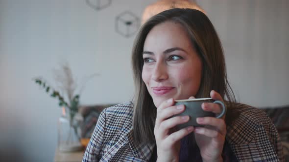 Woman Enjoying Hot Coffee In Cafe