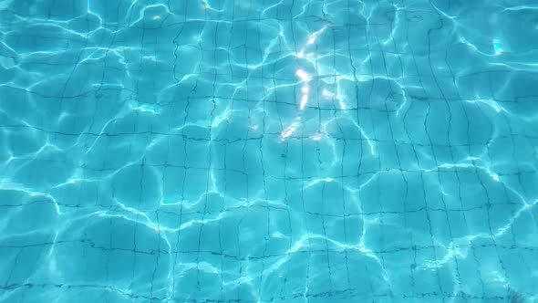 Ripples of Water in the Pool with Light Reflection