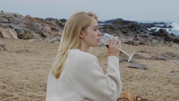 Woman Is Drinking Wine On Beach