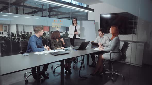 Manager Reporting During Business Meeting in Office alt