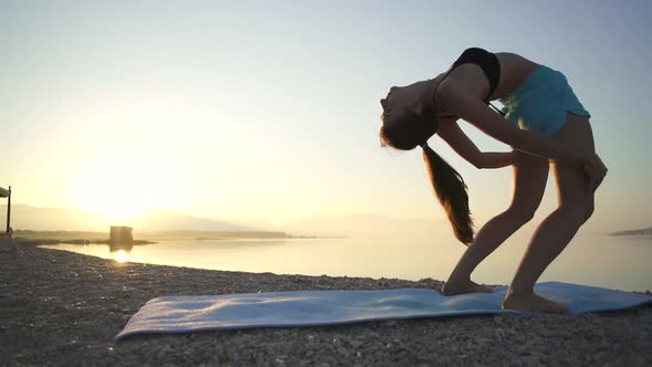 Beautiful Girl Warms Up and Practices Yoga By the Sea, Sports, Yoga, Beach, Slow Motion