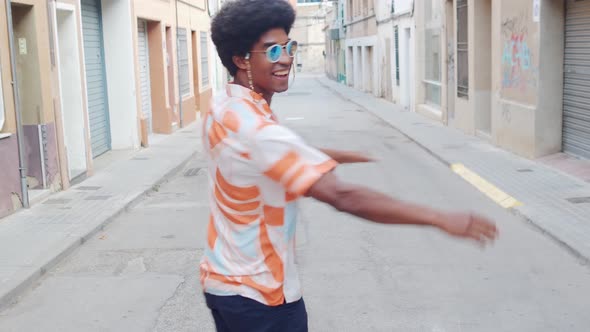 Funny Funky African American Man Happily Dancing on the Street alt