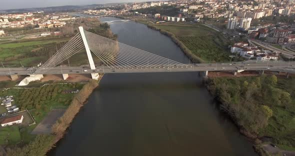 View Of Rainha Santa Isabel Bridge In Coimbra With Different Buildings and Trees - Drone Shot alt