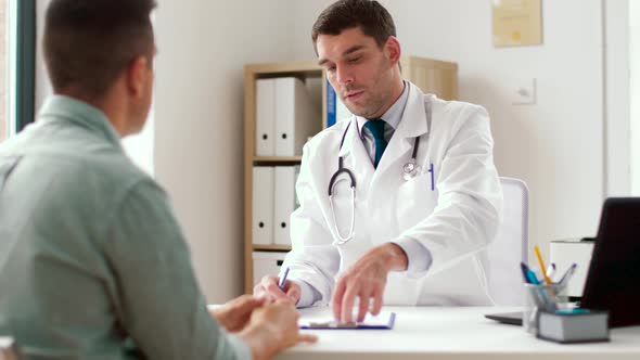 Doctor Giving Prescription for Patient at Clinic 37 alt