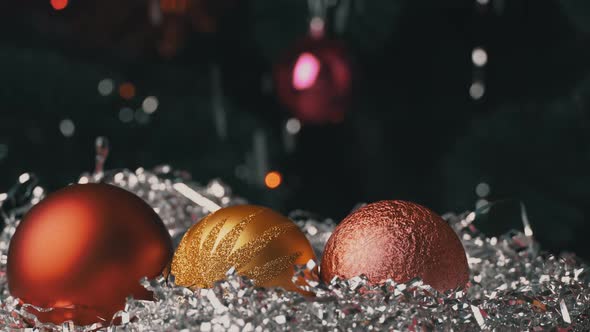 New Year's Toys Lie on the Background of Snow and a New Year Tree alt