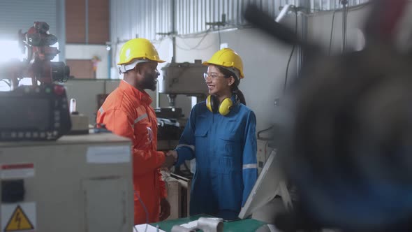 engineer cooperation male and female technician maintenance control relay robot alt