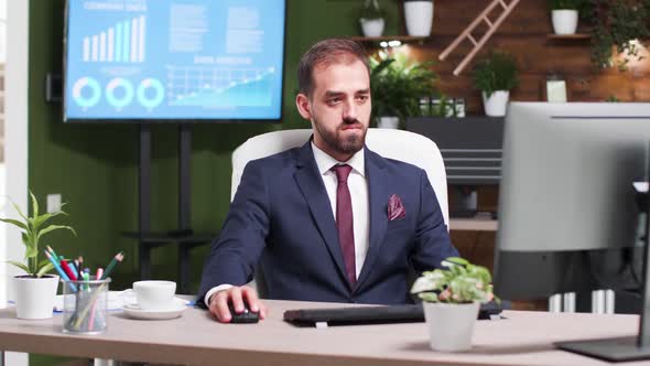 In Modern Creative Office Young Businessman Types on Computer Keyboard alt