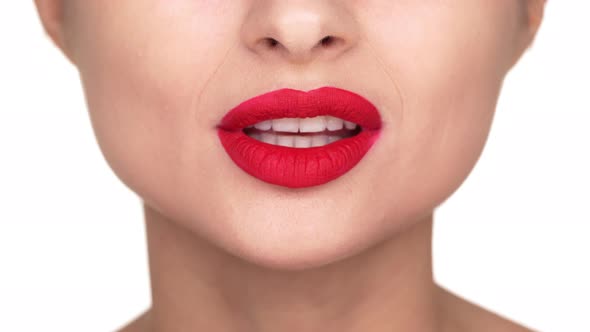 Headshot of Seductive Female Face Having Flirty Emotions Doing Kissing Gesture with Red Matte Makeup alt