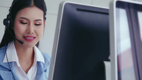 Customer Support Agent or Call Center with Headset Talking to Customer on Phone alt