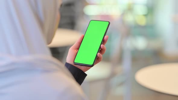 Arab Woman Using Smartphone with Chroma Screen alt