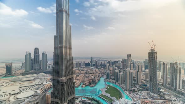 Paniramic Skyline View of Dubai Downtown with Mall Fountains and Burj Khalifa Aerial Timelapse alt