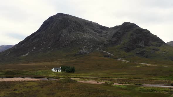 Aerial view of a cottage in a remote location of the highlands in Scotland