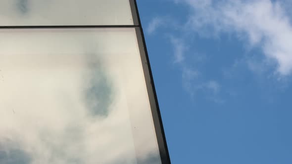 Cloud reflections on office building windows