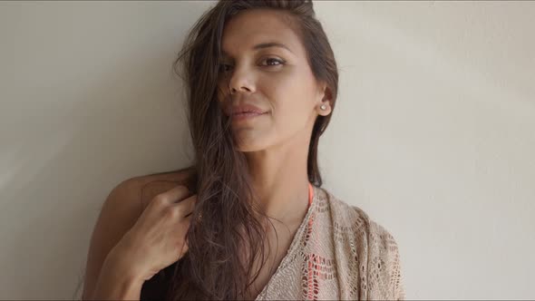 Laughing Woman Covering Her Mouth with Hand alt