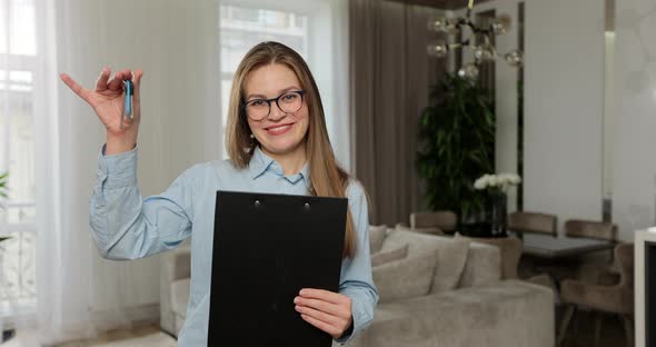 Portrait of Happy Friendly Real Estate Agent in Apartment alt