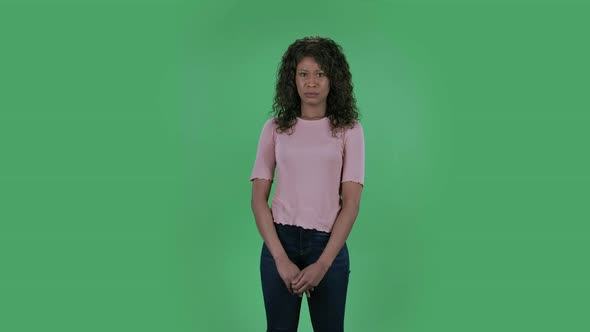 Portrait of Beautiful African American Young Woman Is Haughty and Arrogant Looking at the Camera alt