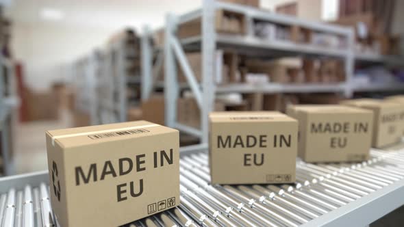 Boxes with MADE IN EU Text on Conveyor alt