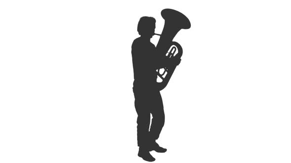 Silhouette of a Man Playing Tuba