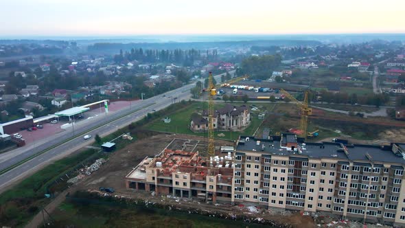 Construction of a new residential multi-storey building. Two tower cranes are completing